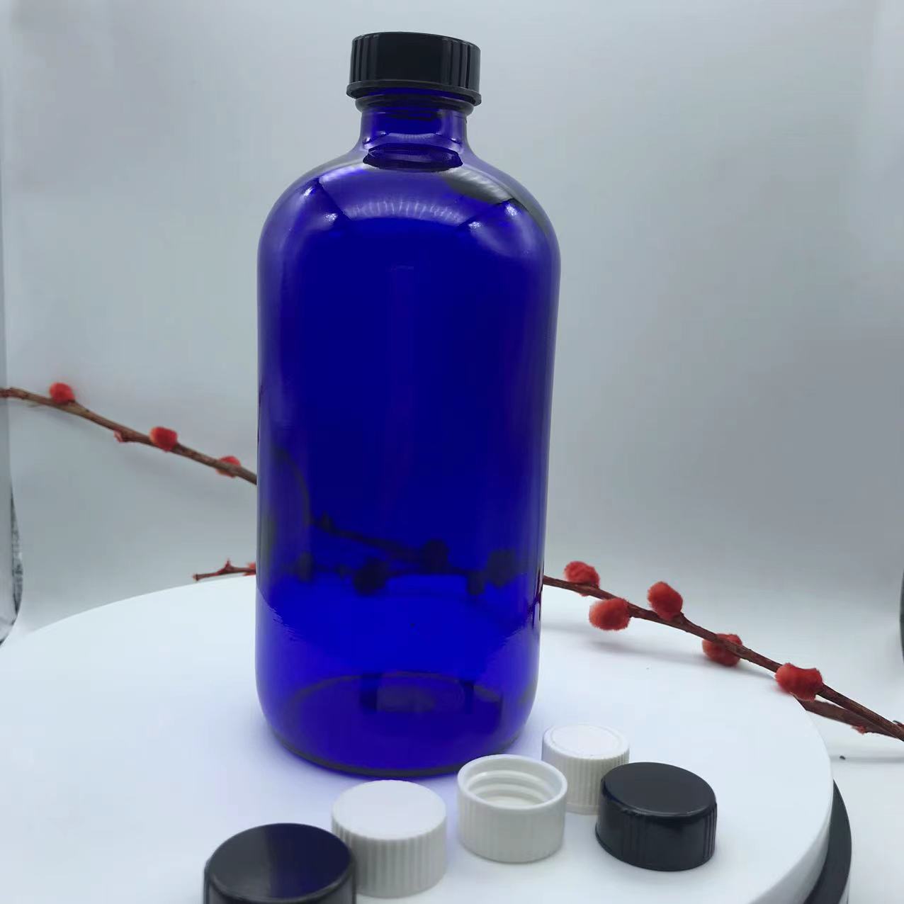 8 OZ Blue Boston Round Glass Bottle