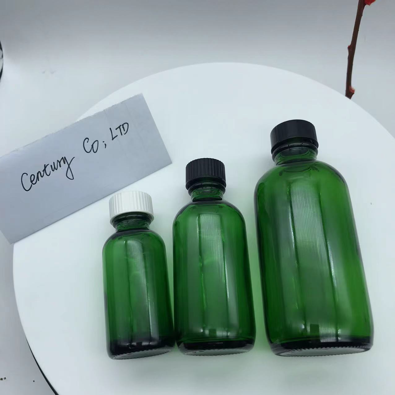 2 OZ Green Boston Round Glass Bottle