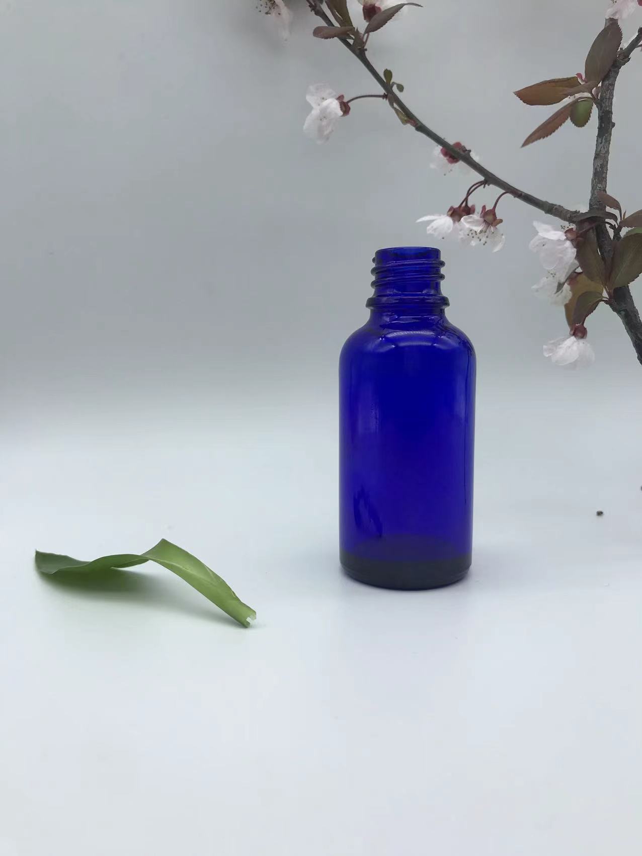 blue dropper glass bottle